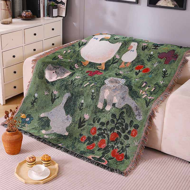 Knitted tassel tapestry throw with little cat print - texture close-up