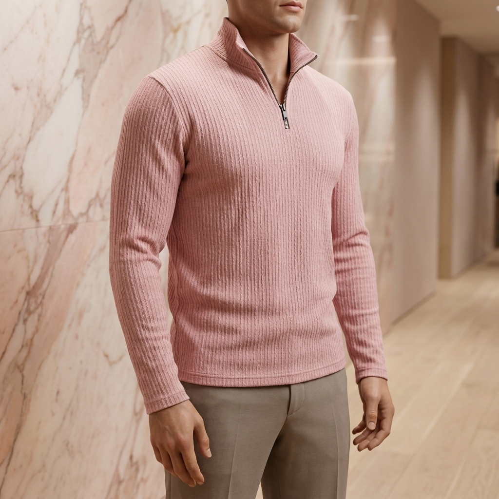 Men's ribbed quarter-zip pullover in lotus pink, on a boutique display mannequin against a rose marble wall and pale oak floor