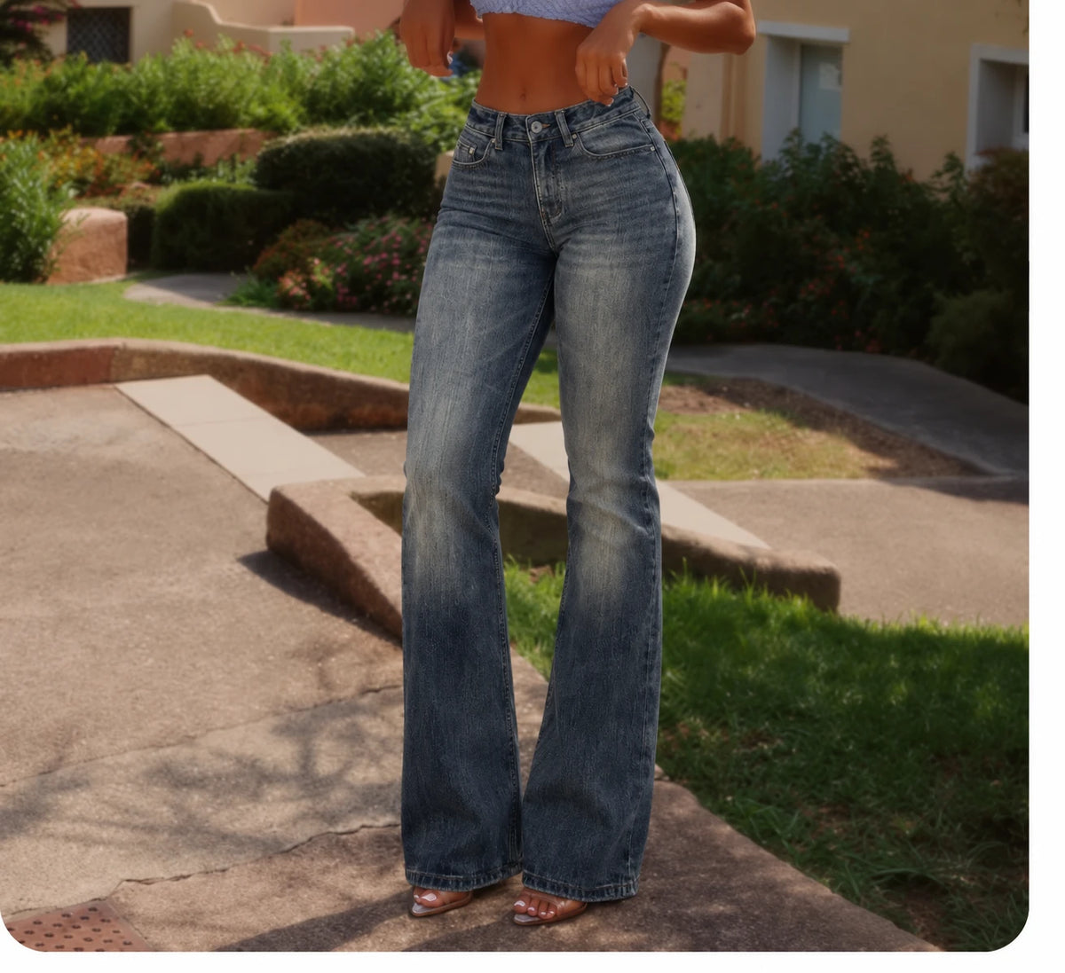 Vintage washed flared denim pants on a model, outdoors